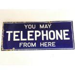 An Enamel Sign stating YOU MAY TELEPHONE FROM HERE