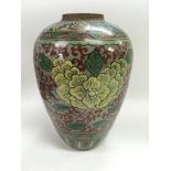 An Oriental vase of baluster form with painted flo