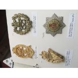 A collection of military cross belt plates and bel