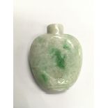 A carved jade snuff bottle decorated with a crane