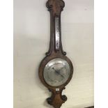 A large quality Victorian walnut barometer with a