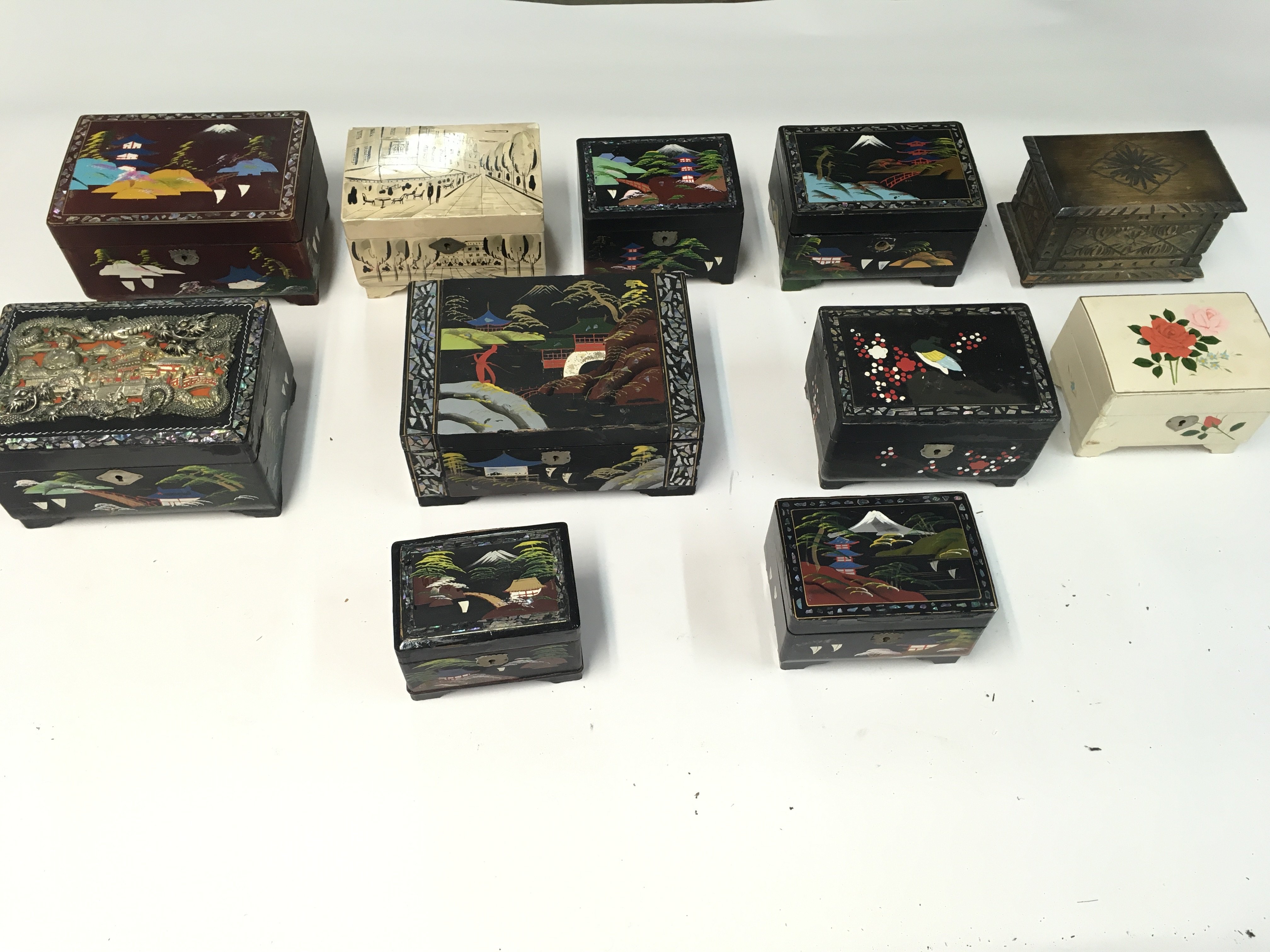 A collection of various music boxes and trinket bo