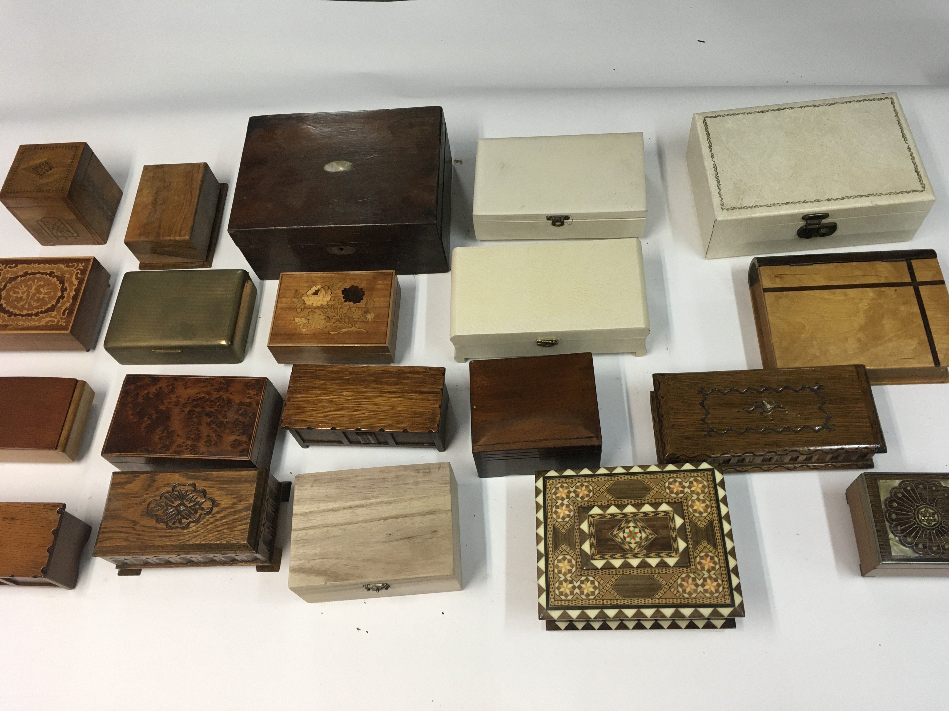 A collection of various music boxes and cigarette