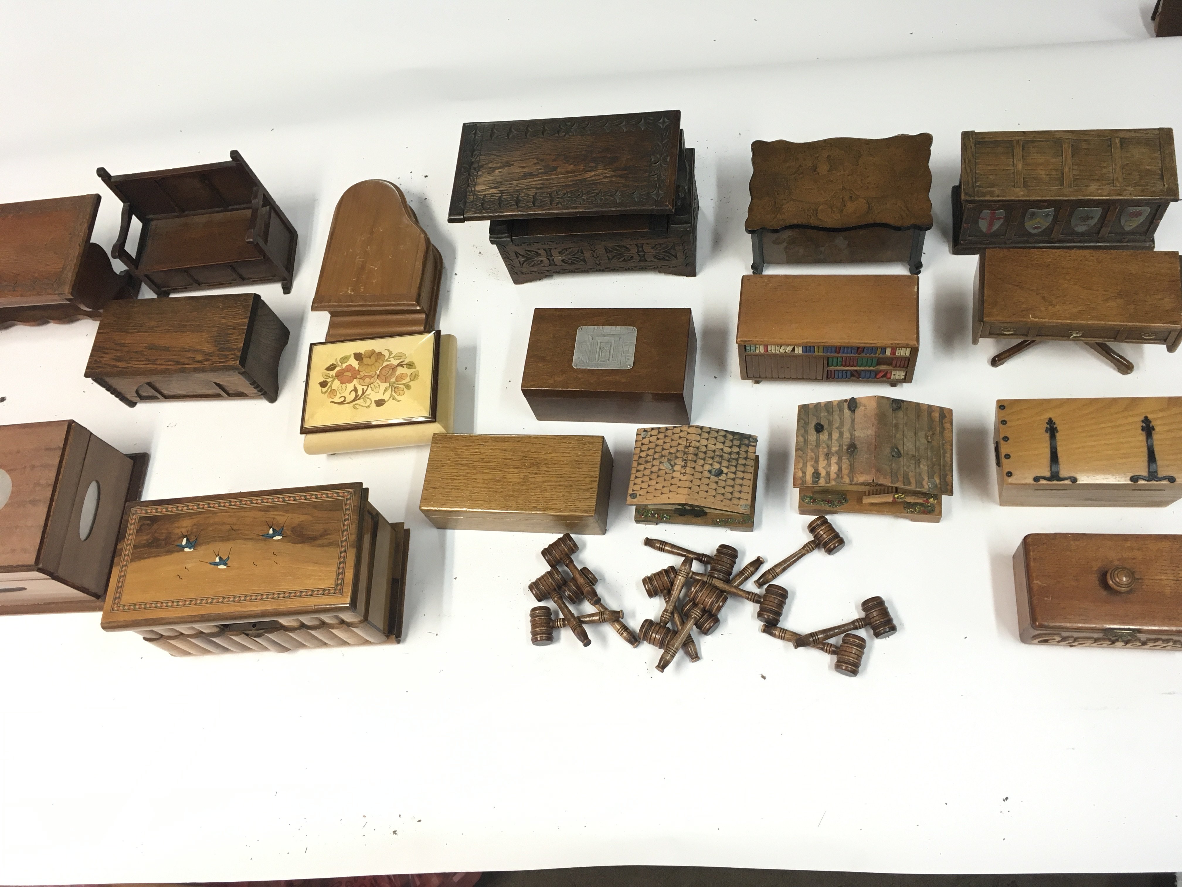 Collection of various music boxes and mini gavels.