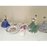 A collection of Doulton figures and Royal Doulton collectors plates.
