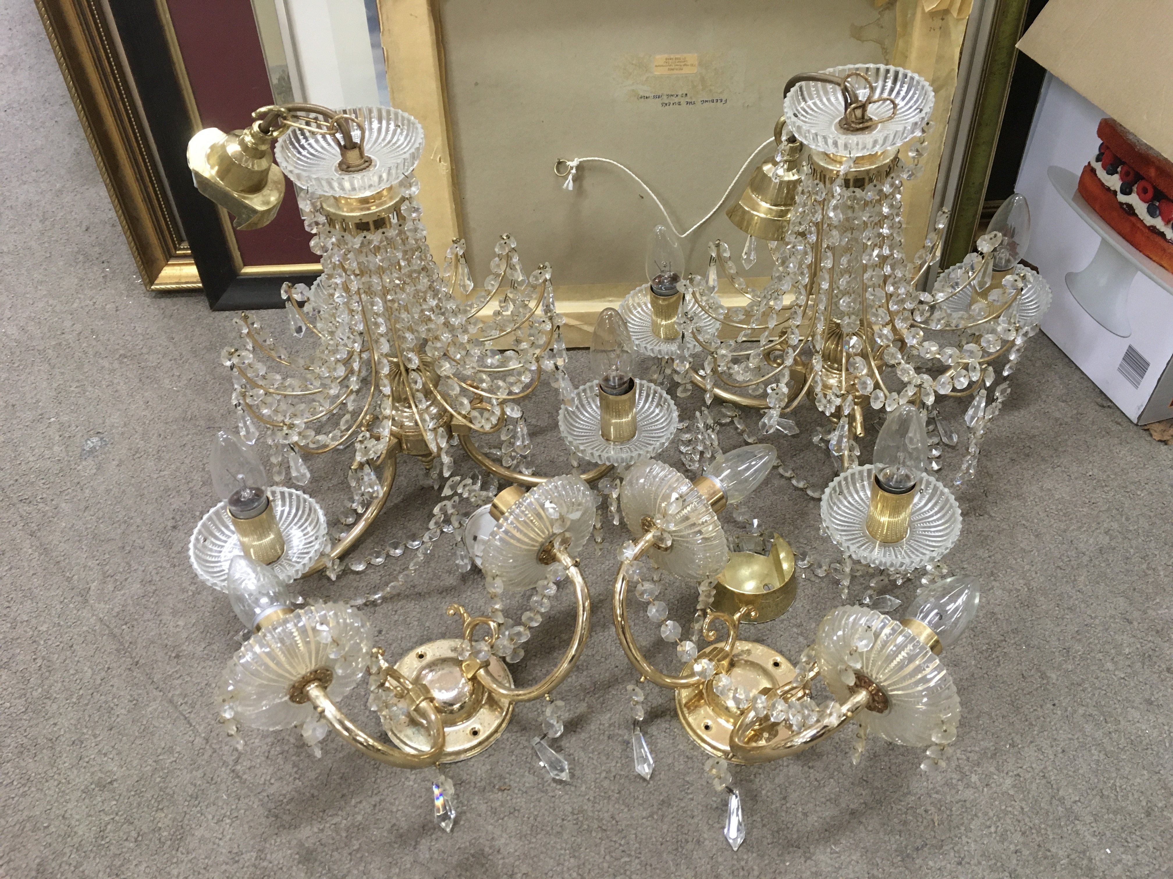 A pair of three branch chandeliers and a pair of c