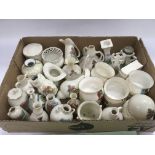 A collection of crested ware items including Goss