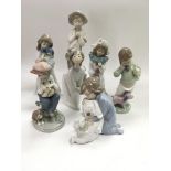 Two Lladro figures of children together with five