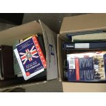 Two boxes containing stamp albums and stamp refram
