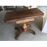 An Early Victorian Rosewood card table. the twin f