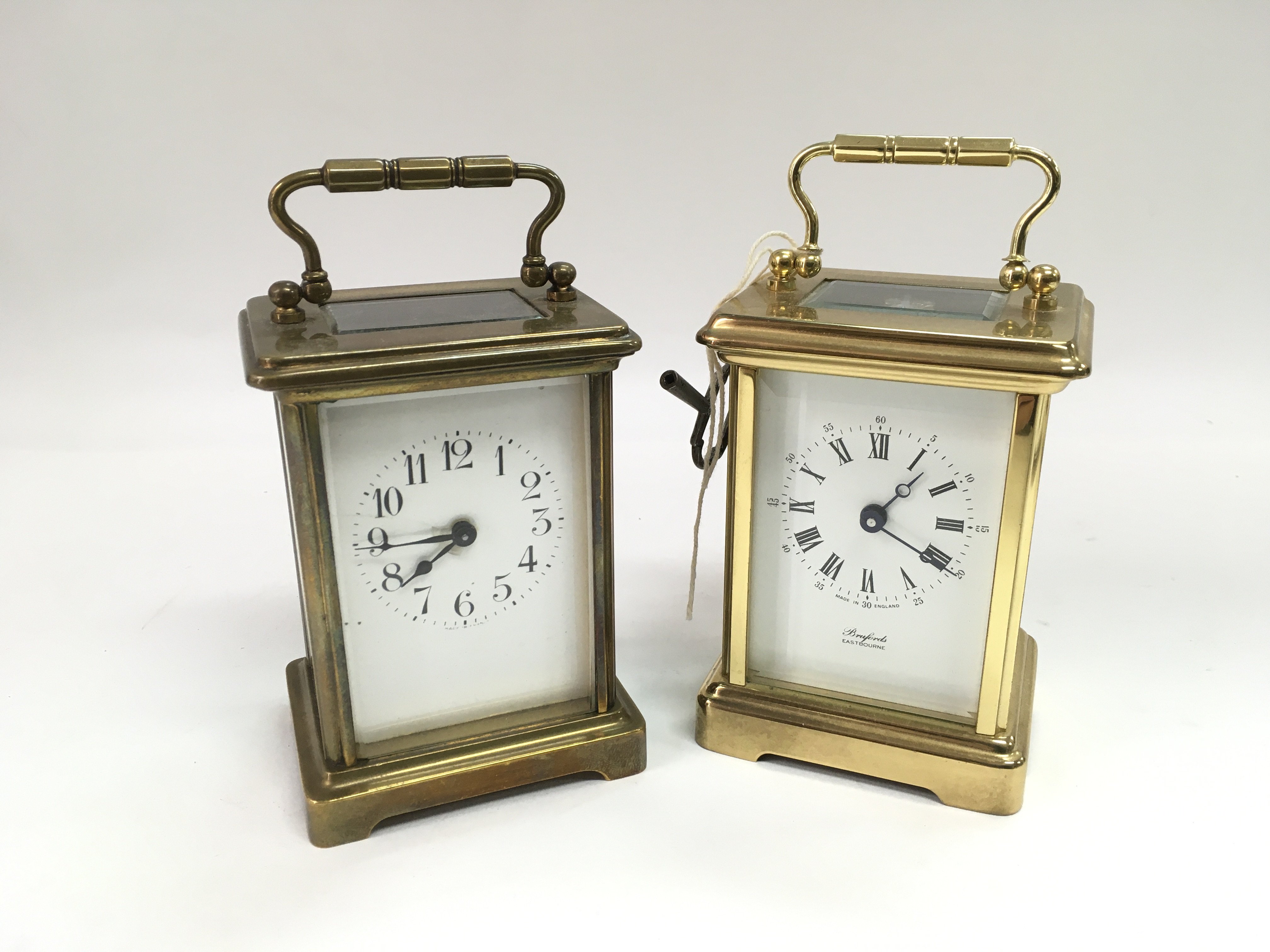 Two antique brass cased carriage clocks.