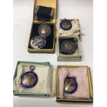 A collection of sporting medallions including silv