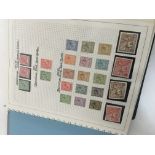 An album containing British unused stamps from Edw
