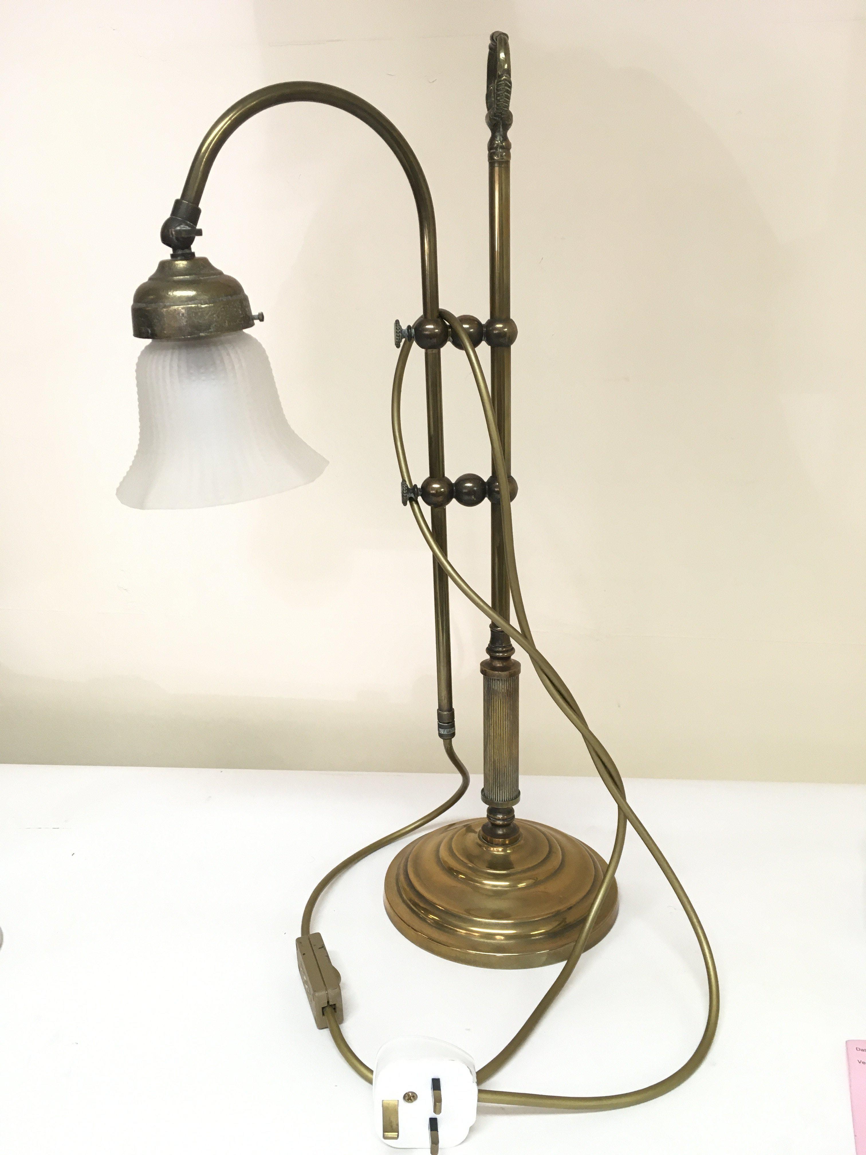 A converted brass table lamp.