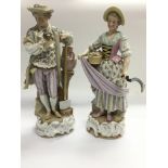 A pair of 19th Century German porcelain figures co