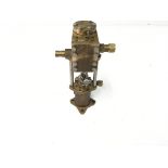 A small static brass steam water pump.