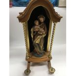 A carved wooden wall hanging statue of the Madonna and child, approx height 40cm.