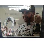 A framed Formula One Photograph of Lewis Hamilton.