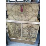 A Art Deco bureau cabinet the fall front above three drawers flanked by A cupboard on a pilth