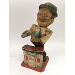 A vintage Charley Weaver Bartender toy.