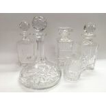 Four glass decanters including one of golfing inte