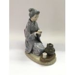 A boxed Lladro figure of a geisha titled 'August M