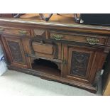 A Edwardian mahogany sideboard fitted with two drawers and cupboards under .