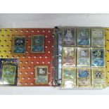 A binder of Pokemon cards.