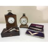 An Edwardian inlaid mahogany mantel clock a walnut