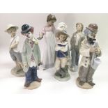 Two Lladro figures of clowns and four Nao figures