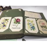 A Edwardian post card Album containing approximately 350 cards including First World War silks .
