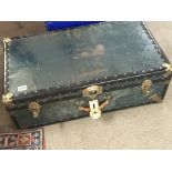 A blue traveling trunk with brass fittings 67x43cm