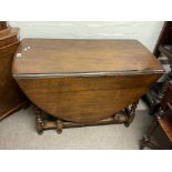 An oak drop leaf table.