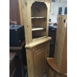 A pine cupboard and a set of open pine shelfs (2)