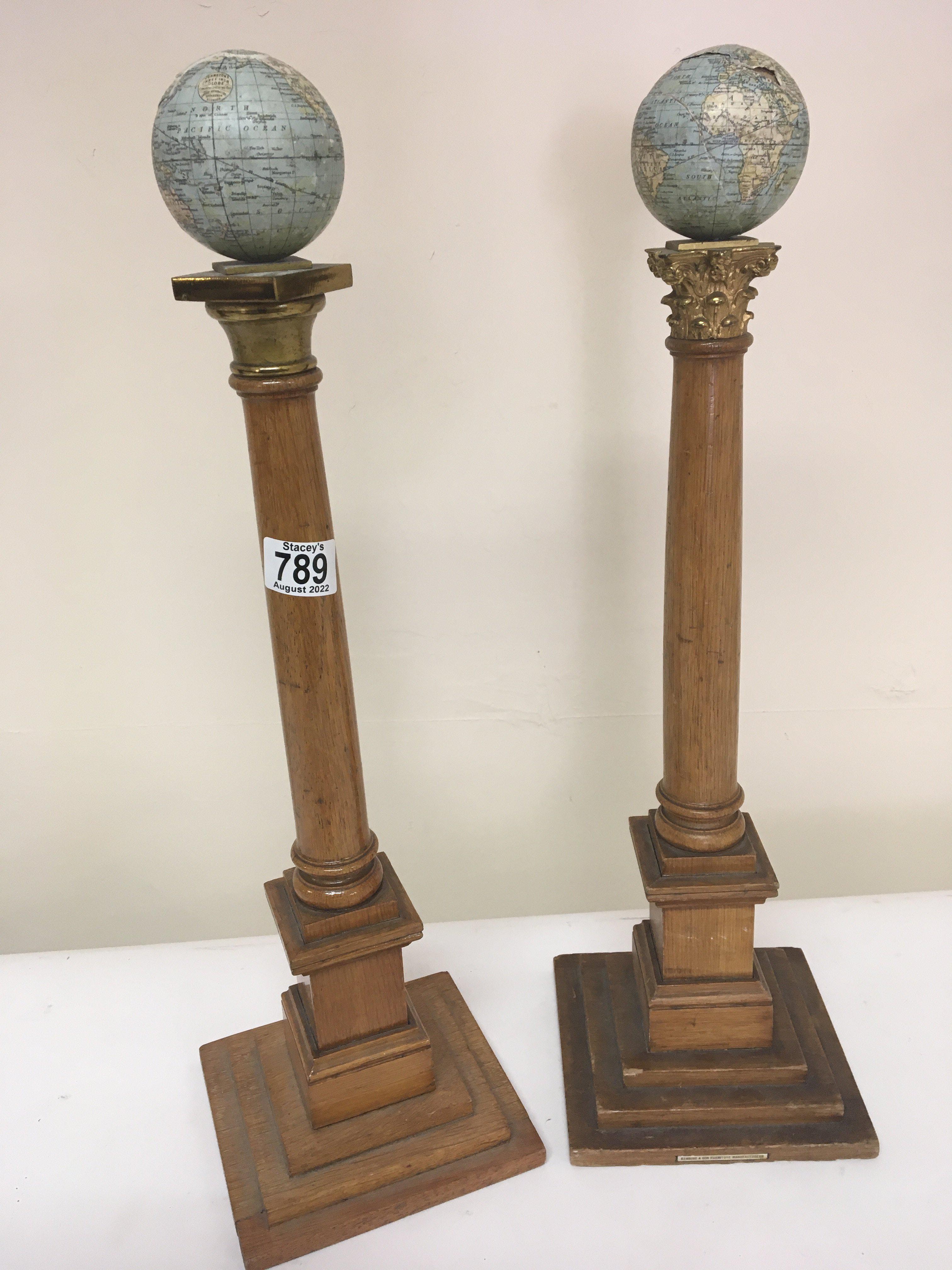 Two Masonic early 20th century columns. Each surmo