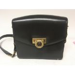 A Vintage Gianni Versace bag brown leather with a