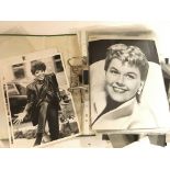 A Folder Containing a Collection of press photos. Including Elizabeth Taylor. Doris Day.Faye Dunaway