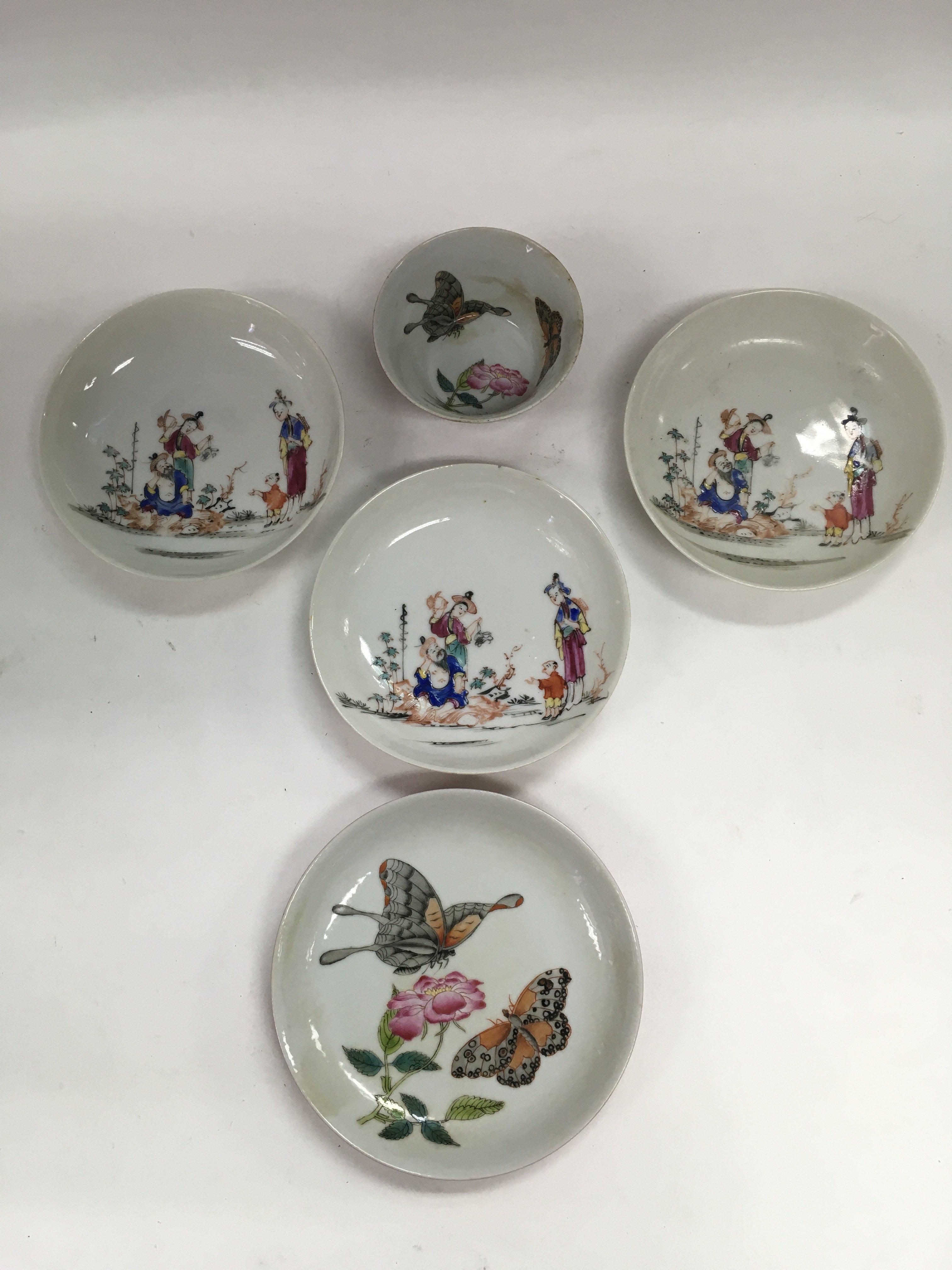 Three Oriental dishes depicting various figures, a