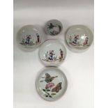 Three Oriental dishes depicting various figures, a