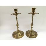 A pair of Indian brass candlesticks, approx height