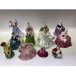 12 Porcelain lady and child figures to include Roy