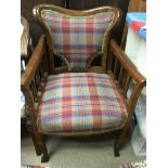 A Victorian barber's chair upholstered in Isla tweed.