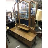 A Continental dressing table with bevelled edge mirrors, approx 130cm x 174cm x 45cm.