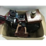 A box of cameras and accessories including a vinta