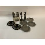 A collection of pewter items, including salt & pepper shakers. No reserve.