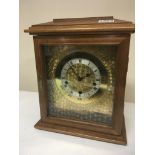 A Walnut mantel clock with a month chart outer dia