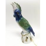 A Capodimonte figural lamp in the form of a parrot