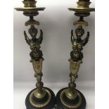 A pair of Empire style candle sticks in the form o