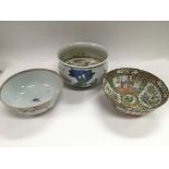 Three Oriental bowls comprising a famille rose exa
