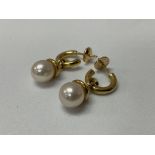 A matching pair of 18 ct Pearl and diamond drop ea